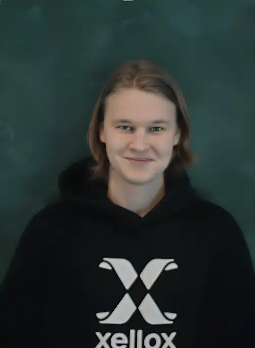 Portrait of Samuel Harjunpää in a black Xellox hoodie. He ensures Xellox meets high standards and delivers real value while promoting Bitcoin adoption.